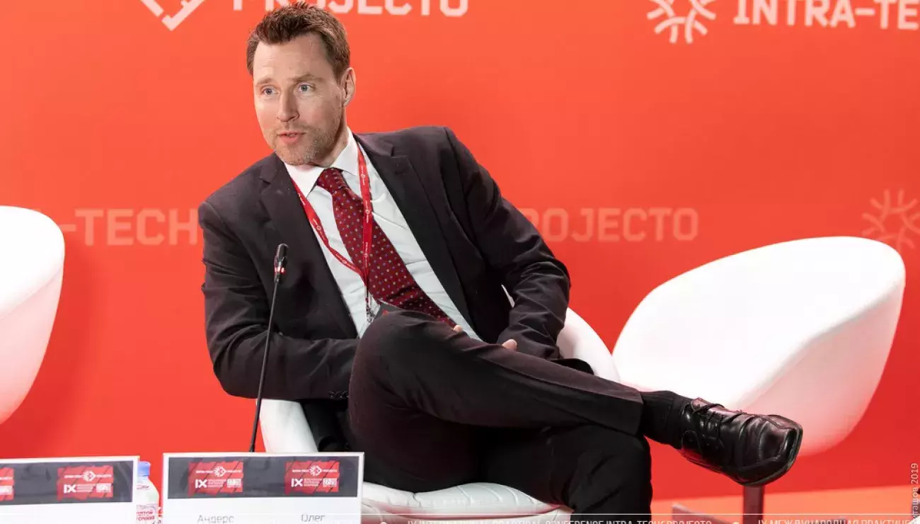 a person sitting in a white chair