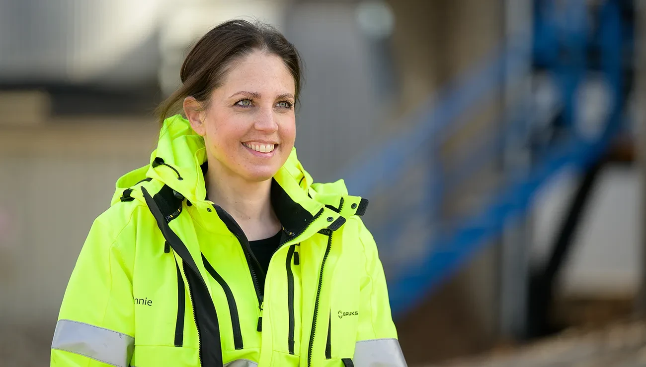 a woman in high visibility jacket
