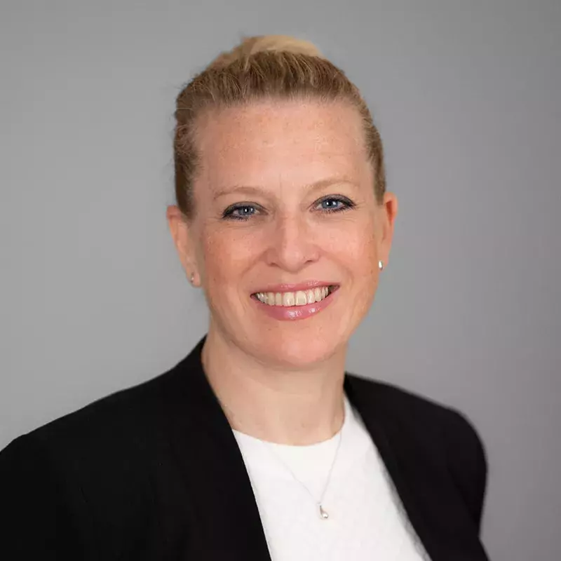 woman with white shirt and black blazer