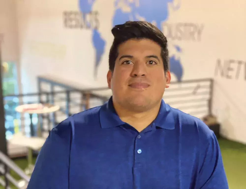 Man in blue shirt in office