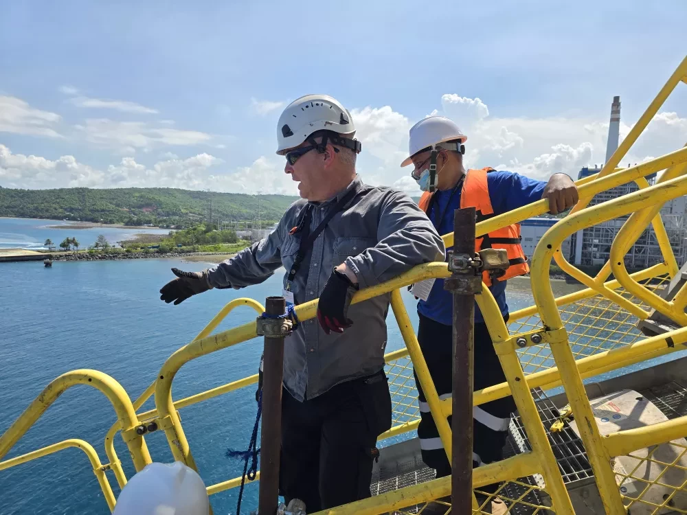 Two people standing on a Siwertell ship unloader