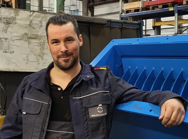 christian ratzke standing in a workshop