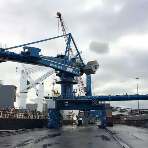 Blue Siwertell Ship unloader in operation