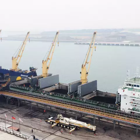 Blue Siwertell Ship unloader in operation