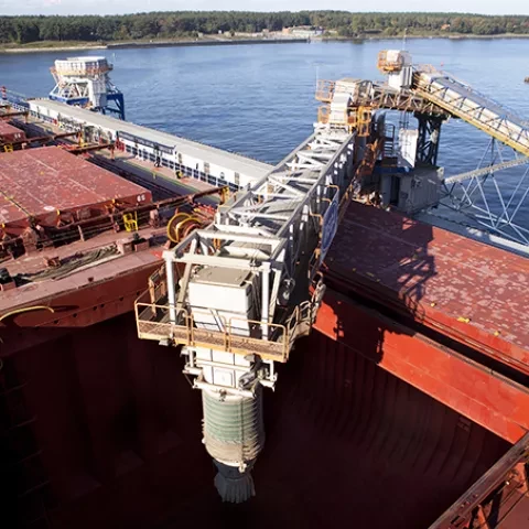 Ship loading arm loading grain into ship hold