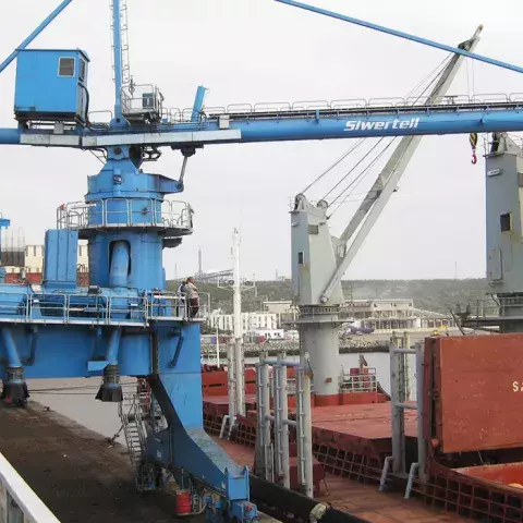 Blue Siwertell Ship unloader in operation