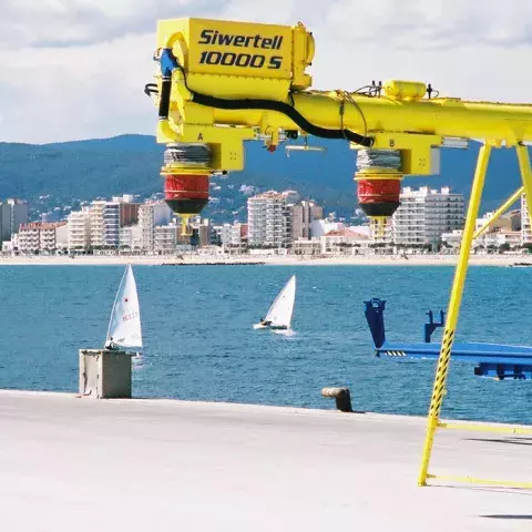 Yellow Siwertell mobile unloader by the harbor