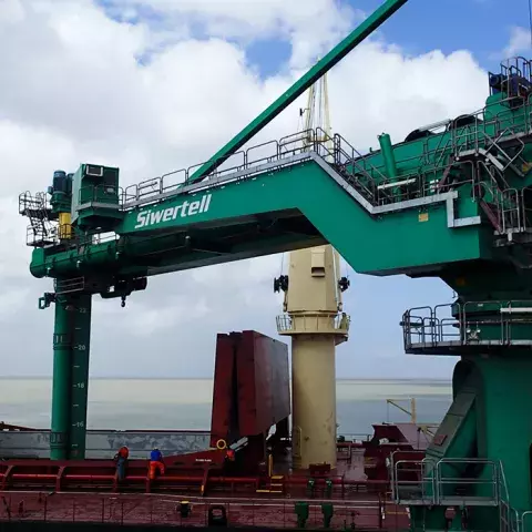 Green Siwertell Ship unloader in operation