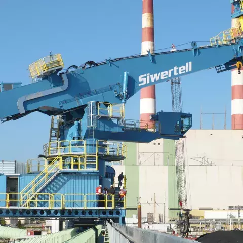 Blue Siwertell Ship unloader in operation
