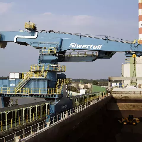 Blue Siwertell Ship unloader in operation