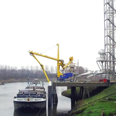 Yellow Siwertell mobile unloader by the harbor