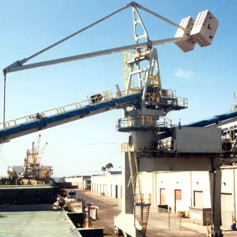 White and blue Siwertell Ship unloader in operation