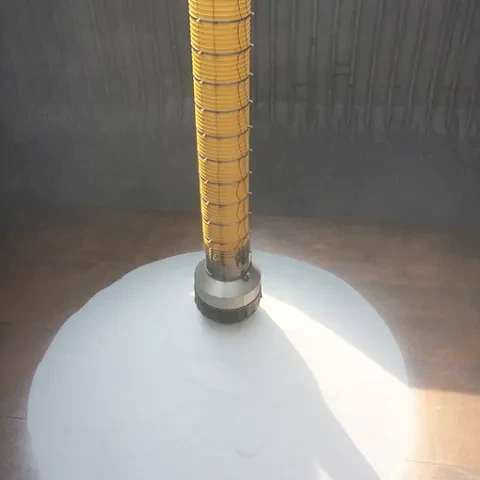 Loading chute dropping urea into ship hold