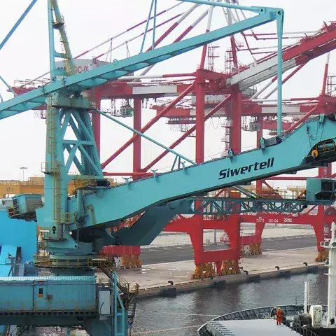Blue Siwertell Ship unloader in operation