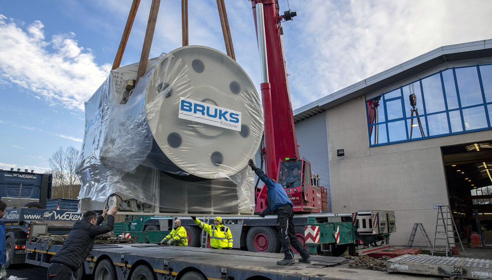 Bruks Klöckner Drum chipper loaded on a truck