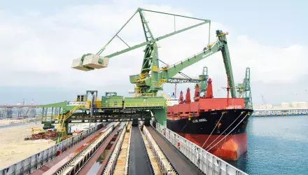 Green Siwertell shipunloader in operation unloading coal from ship in Vietnam