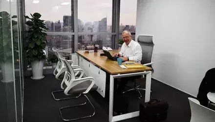 Siwertell director sitting in the chair in the new office in Shanghai