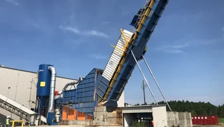 Truck dump unloading material