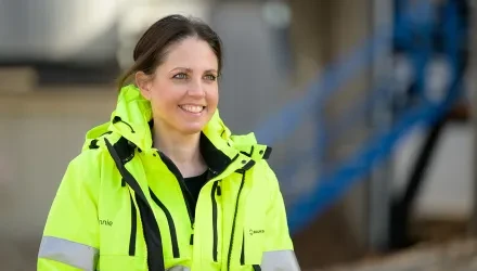a woman in high visibility jacket