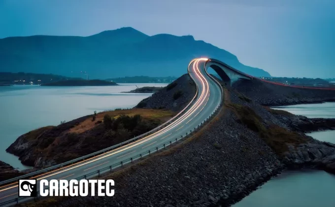 Cargotec logo on landscape with road and mountains