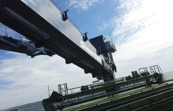 horizontal arm on ship unloader and part of ship